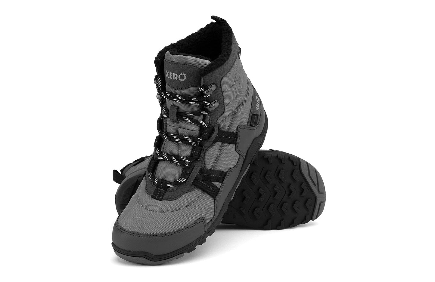 Xero Barefoot Shoes sold in Ontario, Canada. These minimalist shoes have flexible soles, wide toe boxes, and zero drop. Angled pair view of Xero Men's Alpine in Asphalt/Black. Waterproof, lightweight snow boot.