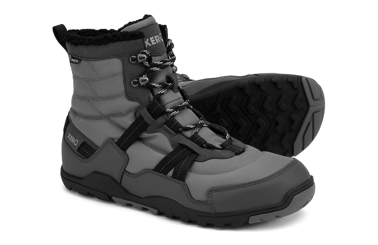 Xero Barefoot Shoes sold in Ontario, Canada. These minimalist shoes have flexible soles, wide toe boxes, and zero drop. Side and sole pair view of Xero Men's Alpine in Asphalt/Black. Waterproof, lightweight snow boot.