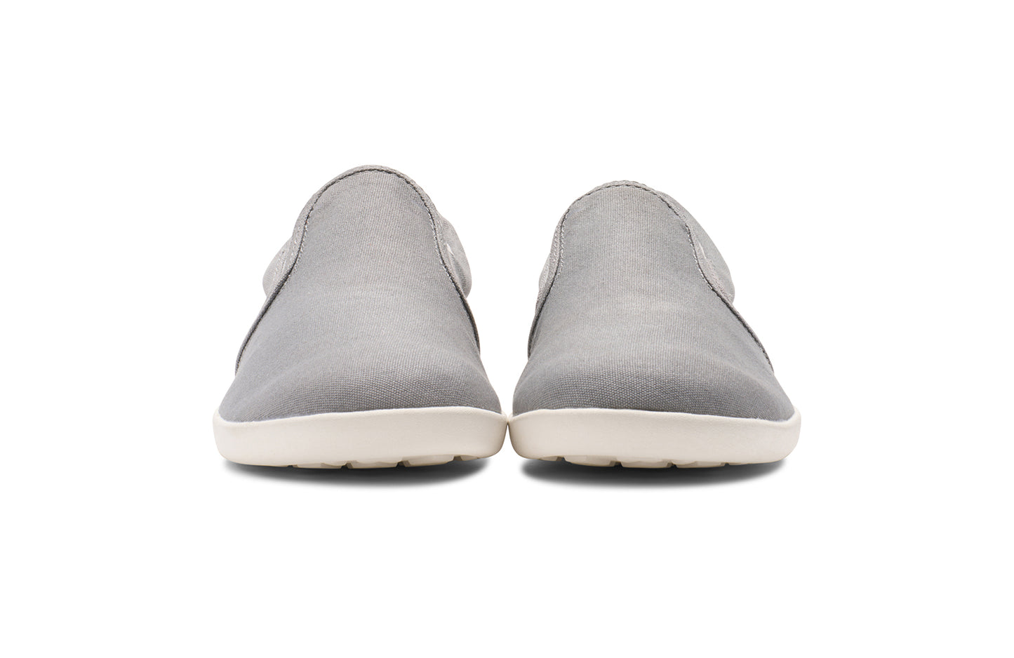 Xero Kid's Barefoot Shoes sold in Ontario, Canada. These minimalist shoes have flexible soles, wide toe boxes, and zero drop. Front view of Xero Youth Dillon Canvas Slip-On in Alloy.