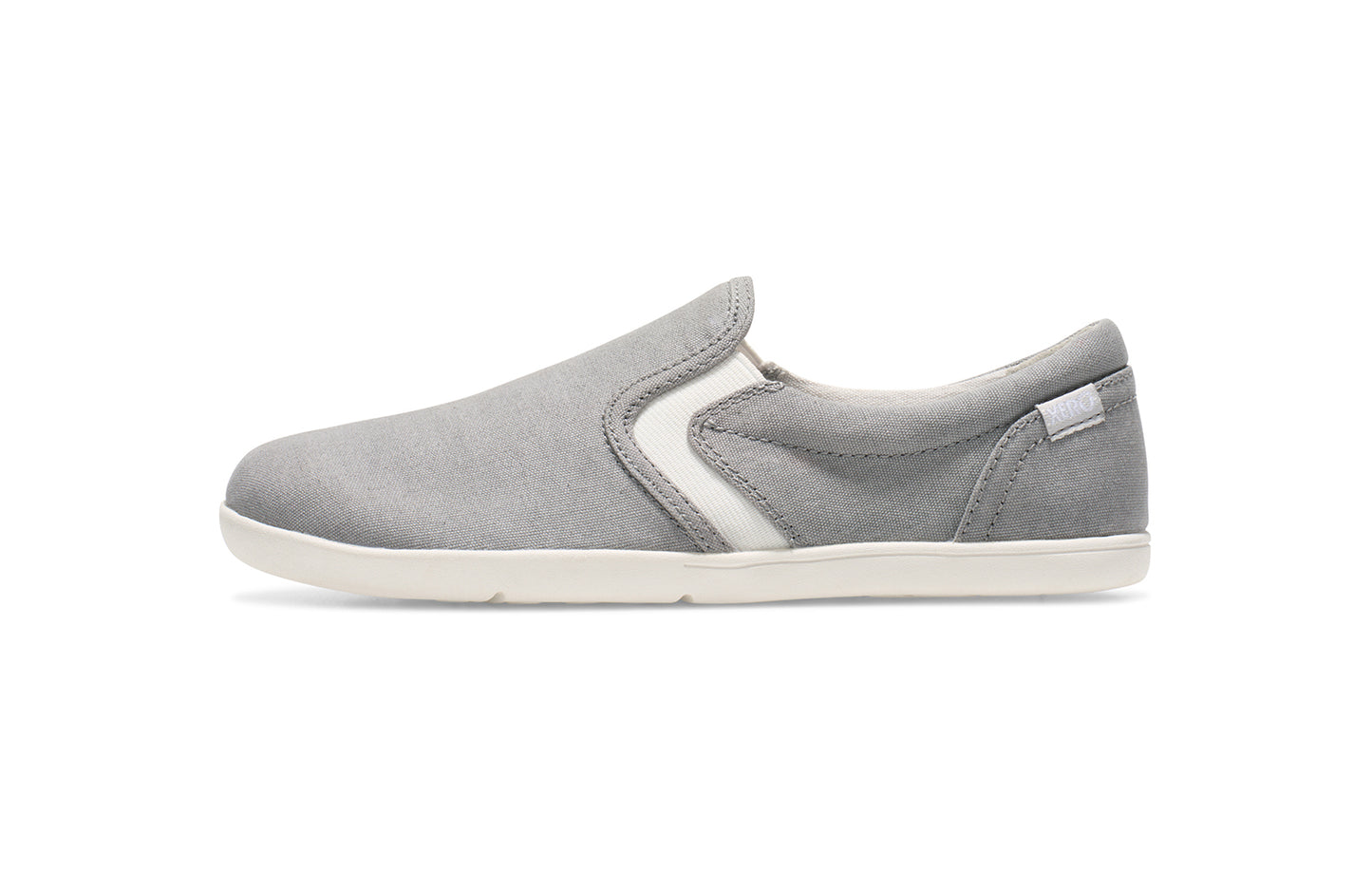 Xero Kid's Barefoot Shoes sold in Ontario, Canada. These minimalist shoes have flexible soles, wide toe boxes, and zero drop. Side view of Xero Youth Dillon Canvas Slip-On in Alloy.
