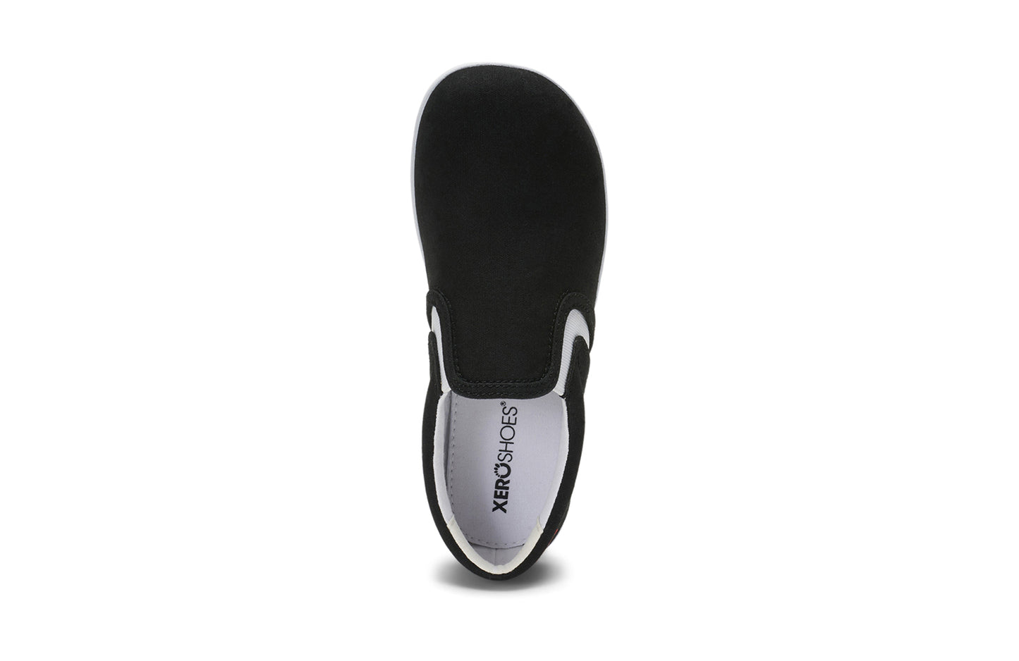 Xero Kid's Barefoot Shoes sold in Ontario, Canada. These minimalist shoes have flexible soles, wide toe boxes, and zero drop. Top view of Xero Youth Dillon Canvas Slip-On in Black.