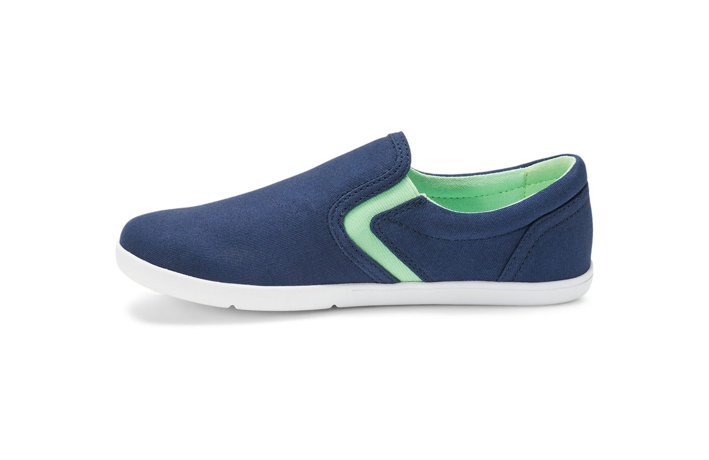 Xero Kid's Barefoot Shoes sold in Ontario, Canada. These minimalist shoes have flexible soles, wide toe boxes, and zero drop. Lateral side view of Xero Youth Dillon Canvas Slip-On in Insignia Blue.