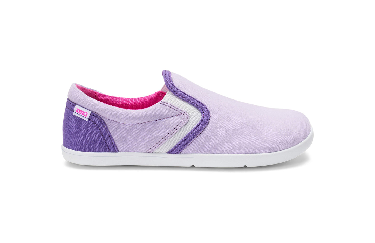 Xero Kid's Barefoot Shoes sold in Ontario, Canada. These minimalist shoes have flexible soles, wide toe boxes, and zero drop. Side view of Xero Youth Dillon Canvas Slip-On in Orchid Petal.