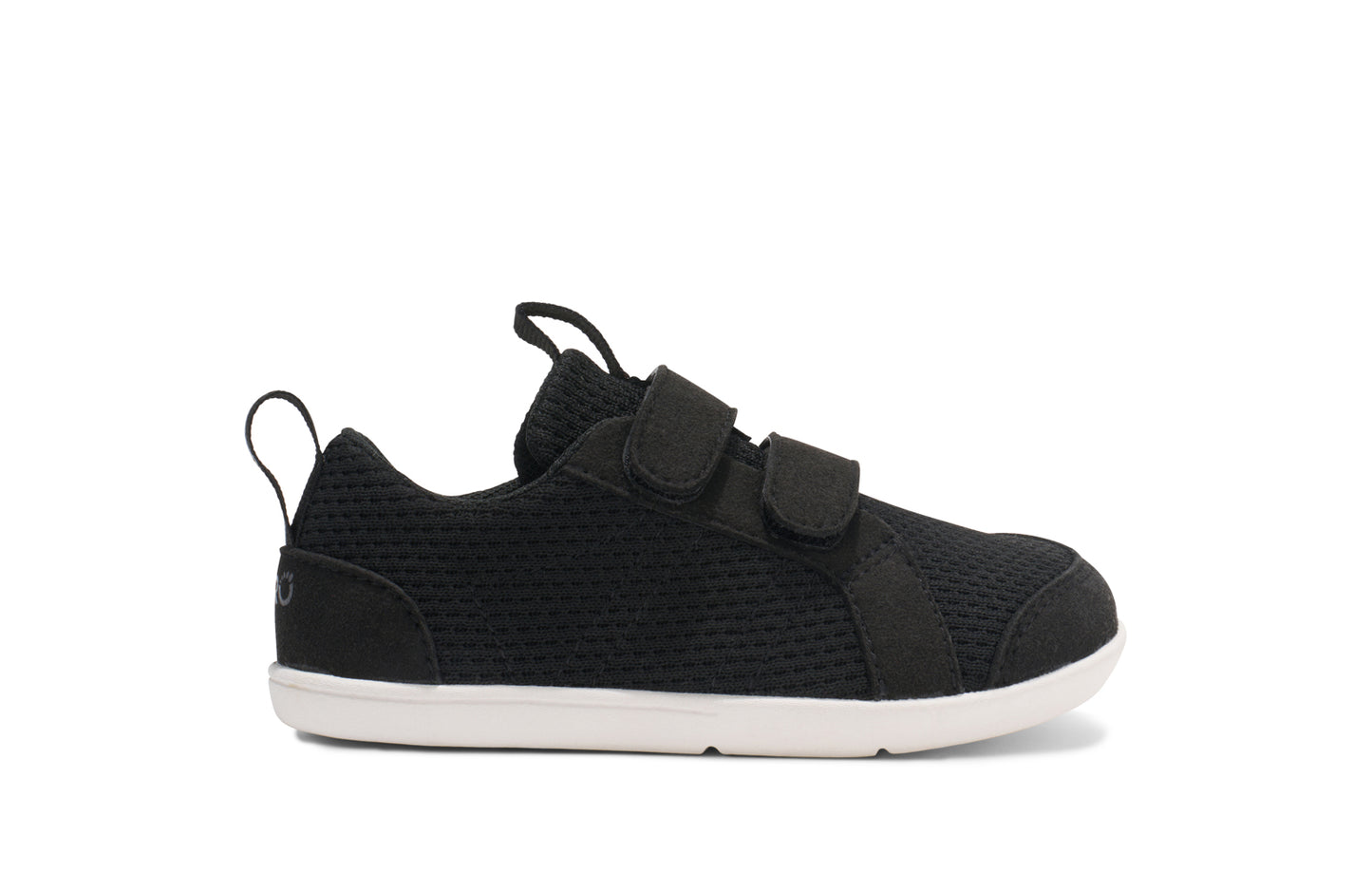 Xero Barefoot shoes for kids sold in Ontario, Canada. These minimalist shoes have flexible soles, wide toe boxes, and zero drop. Side view of Xero Dillon Little Kids in Black, a classic sneaker.