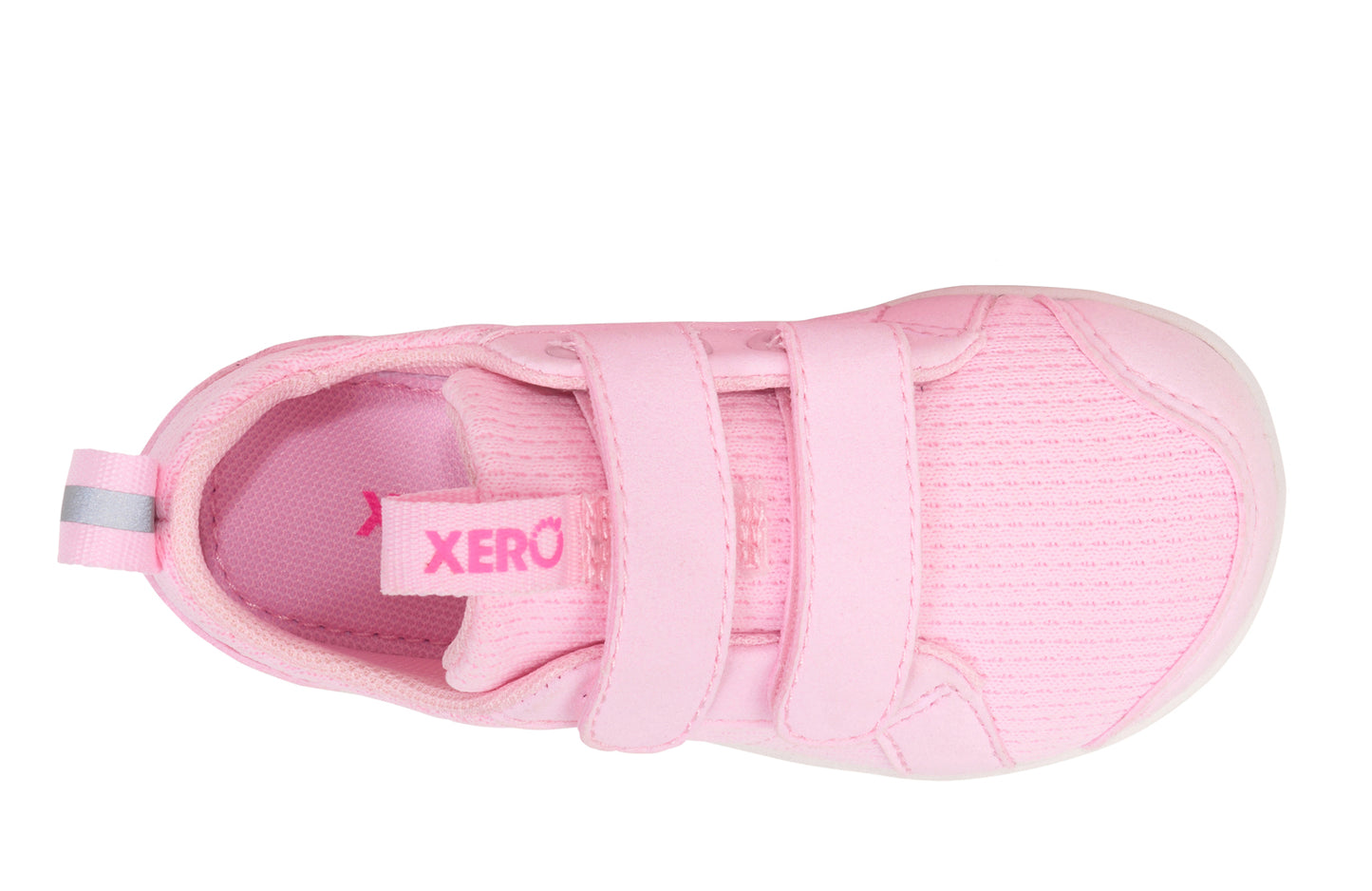 Xero Barefoot shoes for kids sold in Ontario, Canada. These minimalist shoes have flexible soles, wide toe boxes, and zero drop. Top view of Xero Dillon Little Kids in Pink-a-Boo, a classic sneaker.
