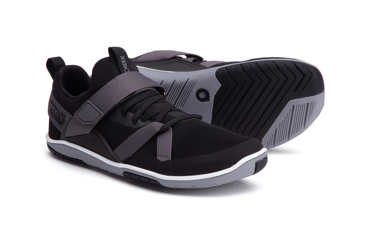 Xero Shoes Canada, specifically barefoot running shoes Canada. These minimalist shoes have flexible soles, wide toe boxes, and zero drop. Pair view of Xero Women's Forza Trainer in Black/Asphalt. A stable training shoe.