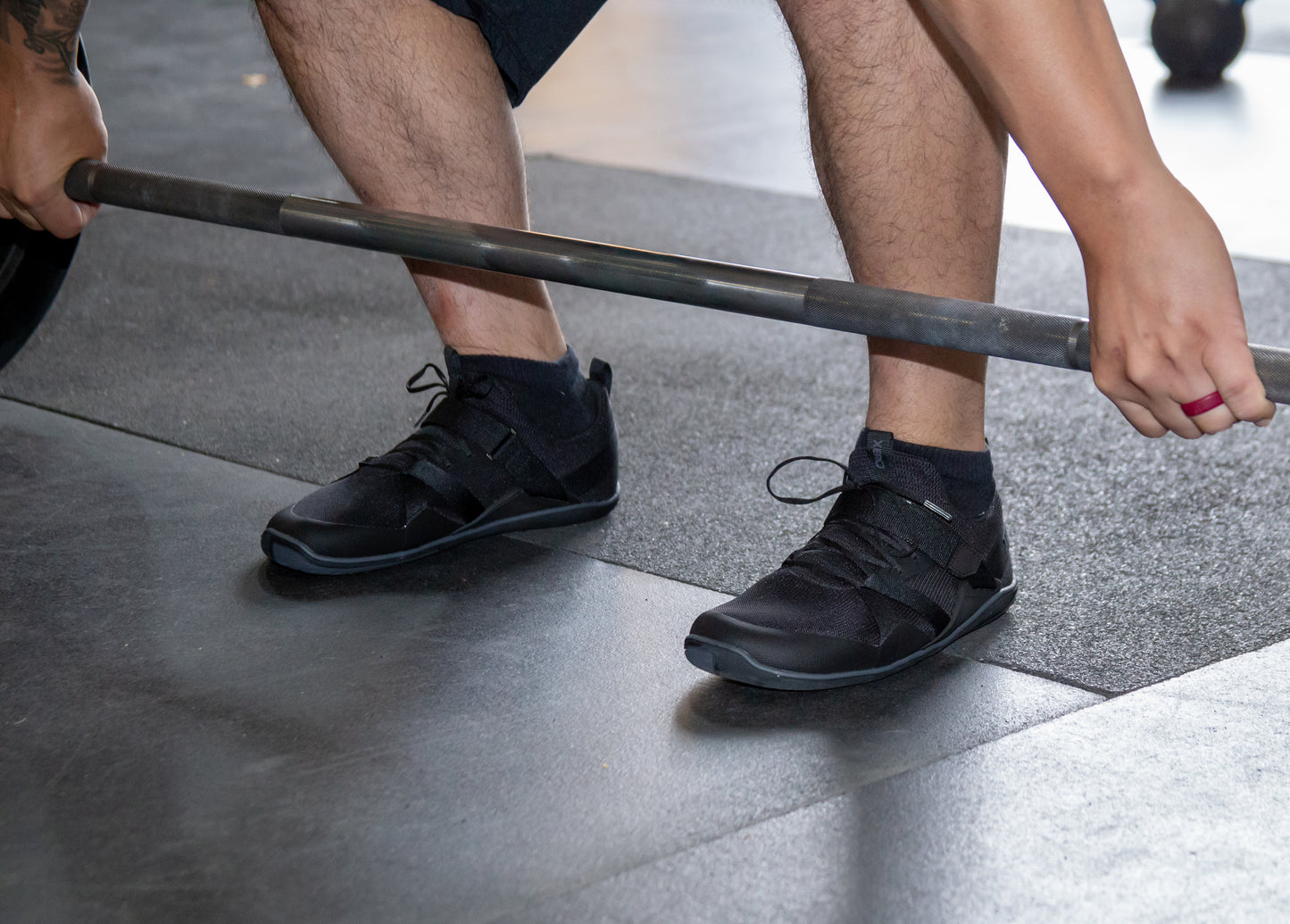 Xero Shoes Canada, specifically barefoot running shoes Canada. Man wearing Forza trainers while weight lifting