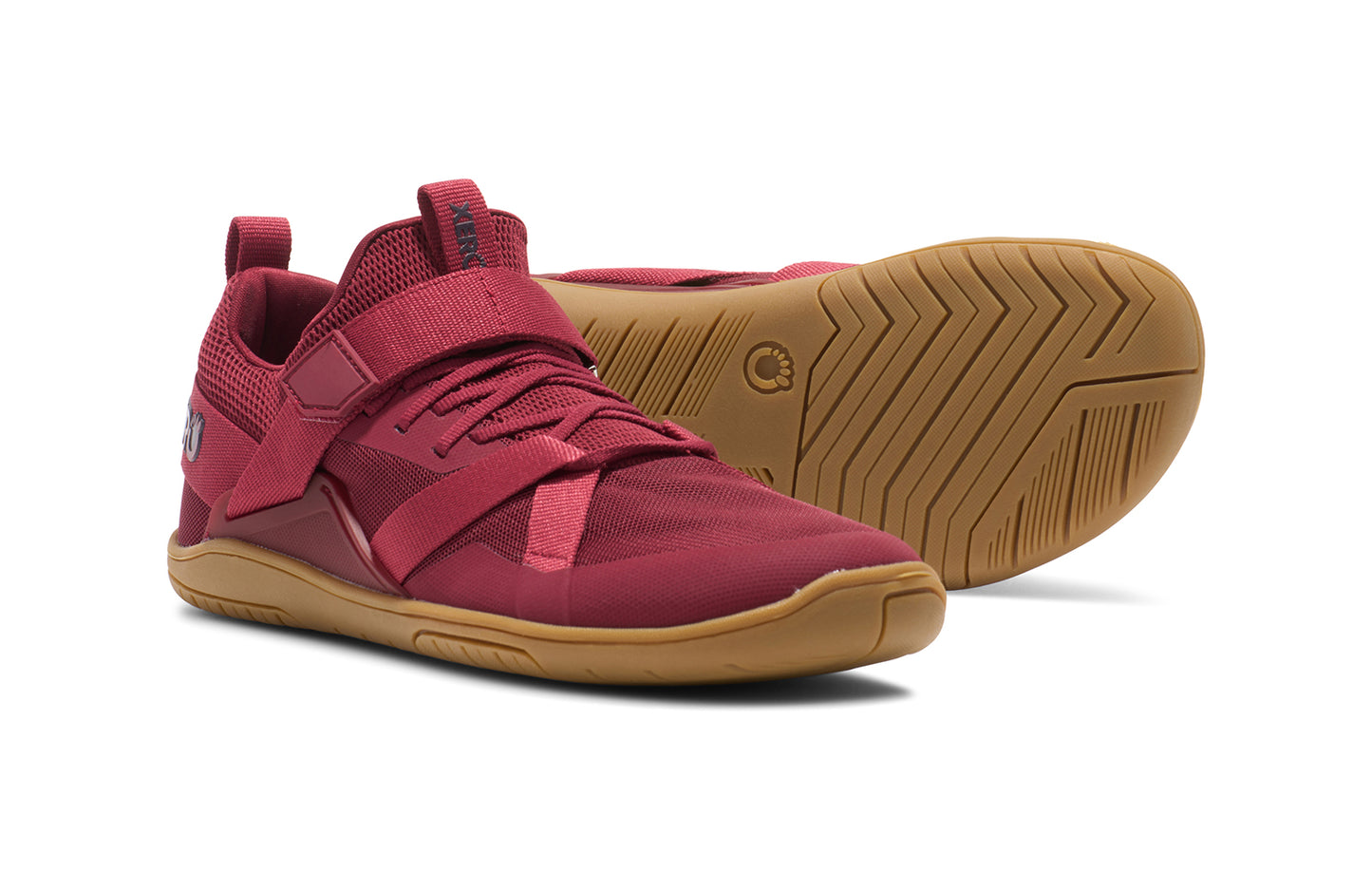 Xero Shoes Canada, specifically barefoot running shoes Canada. These minimalist shoes have flexible soles, wide toe boxes, and zero drop. Pair view of Xero Women's Forza Trainer in Tibetan Red/Gum. A stable training shoe.
