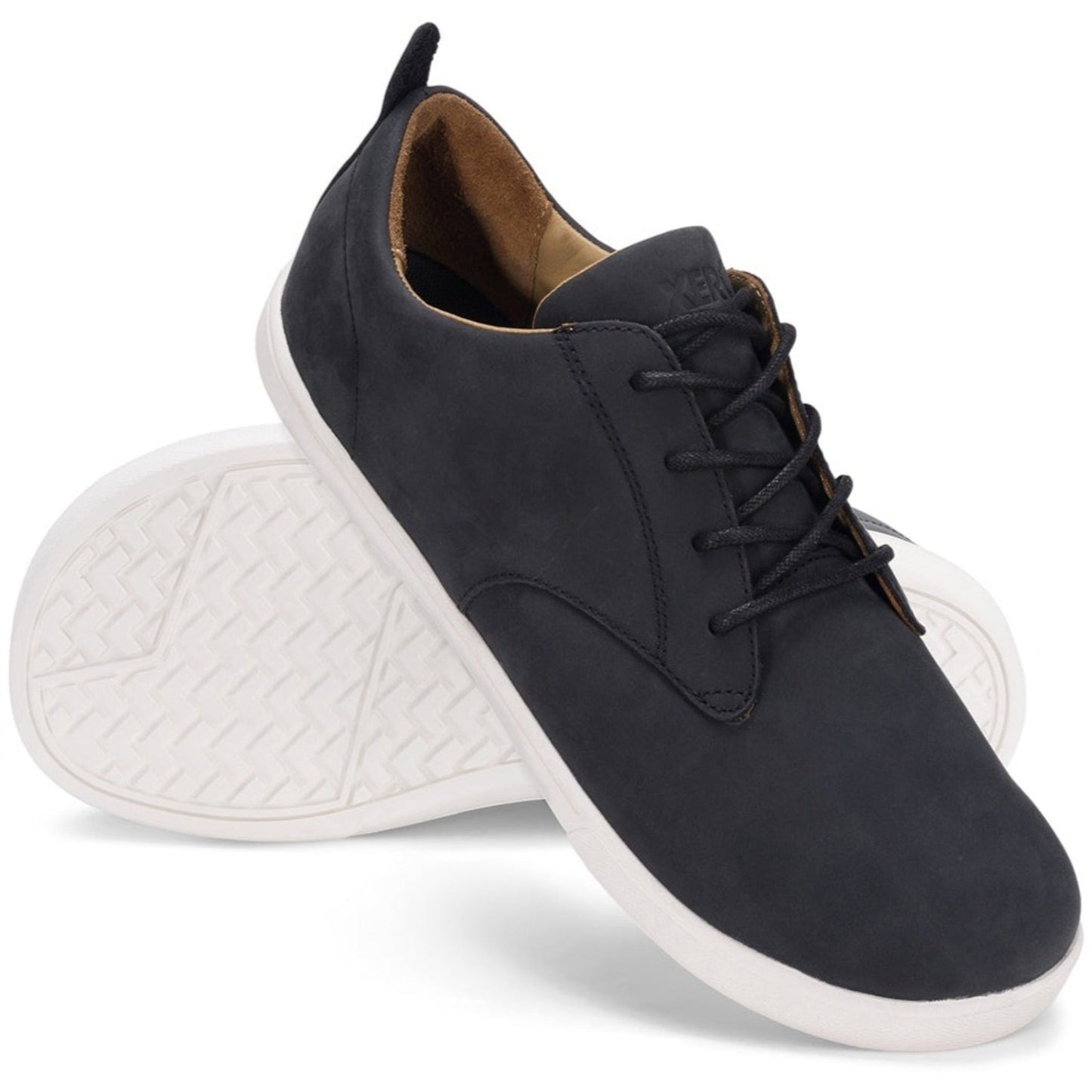 Xero Barefoot Shoes sold in Ontario, Canada. These minimalist shoes have flexible soles, wide toe boxes, and zero drop. Angled pair view of Xero Men's Glenn in Black/White. Dress casual leather shoe.