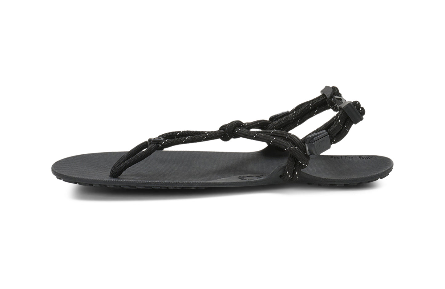 Xero Shoes Canada, specifically women’s barefoot shoes Canada. These minimalist shoes have flexible soles, wide toe boxes, and zero drop. Medial side view of Xero Women's Genesis in Black. Lightweight, packable, travel-friendly sandal.