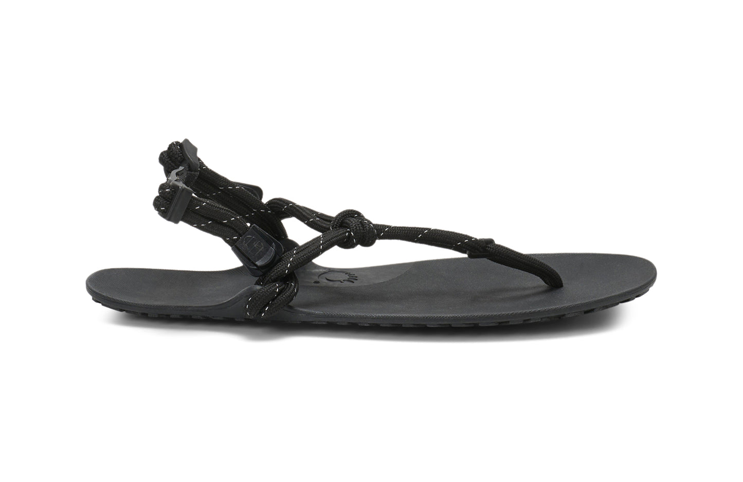 Xero Shoes Canada, specifically women’s barefoot shoes Canada. These minimalist shoes have flexible soles, wide toe boxes, and zero drop. Lateral side view of Xero Women's Genesis in Black. Lightweight, packable, travel-friendly sandal.