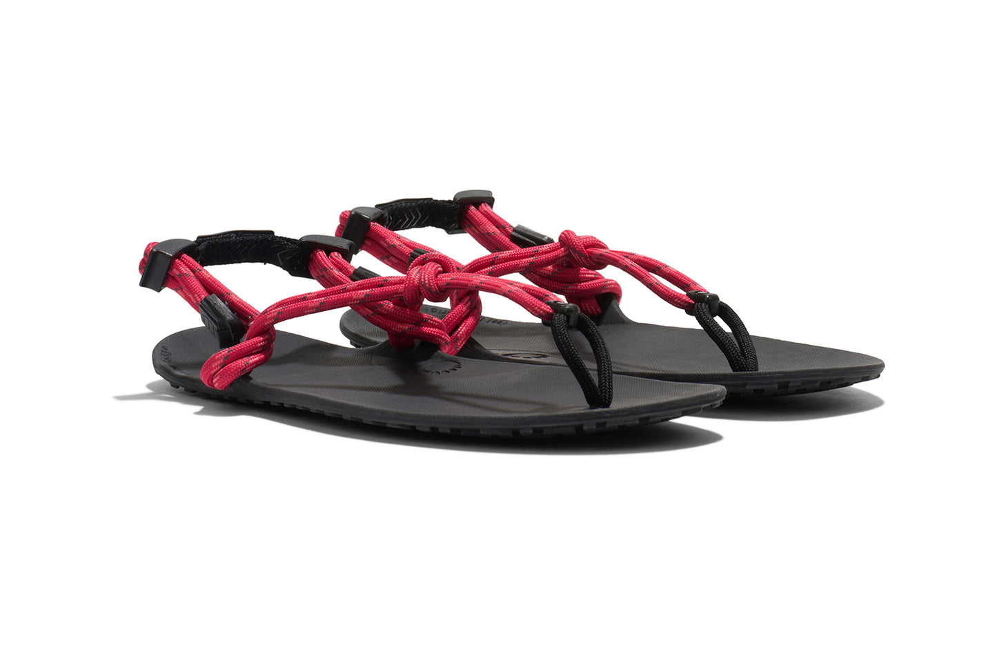 Xero Shoes Canada, specifically women’s barefoot shoes Canada. These minimalist shoes have flexible soles, wide toe boxes, and zero drop. Angled view of Xero Women's Genesis in Raspberry. Lightweight, packable, travel-friendly sandal.