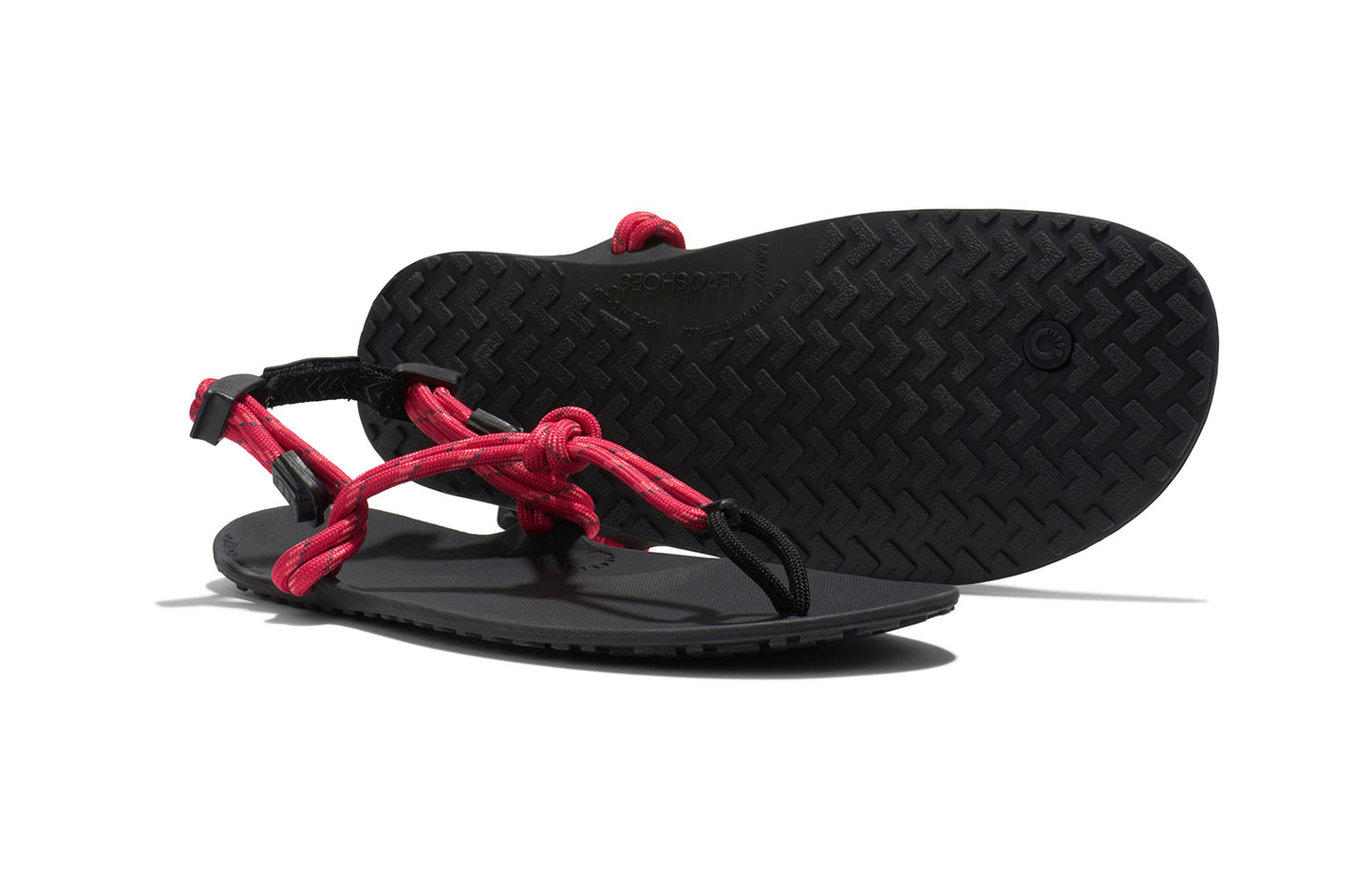 Xero Shoes Canada, specifically women’s barefoot shoes Canada. These minimalist shoes have flexible soles, wide toe boxes, and zero drop. Pair view of Xero Women's Genesis in Raspberry. Lightweight, packable, travel-friendly sandal.