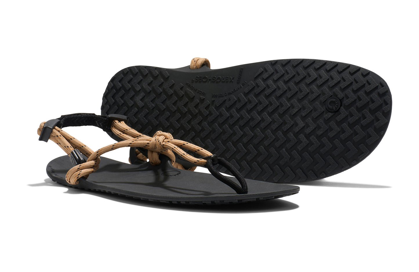 Xero Shoes Canada, specifically men’s barefoot shoes Canada. These minimalist shoes have flexible soles, wide toe boxes, and zero drop. Side and sole pair view of Xero Men's Genesis in Sand. Lightweight, packable, travel-friendly sandal.
