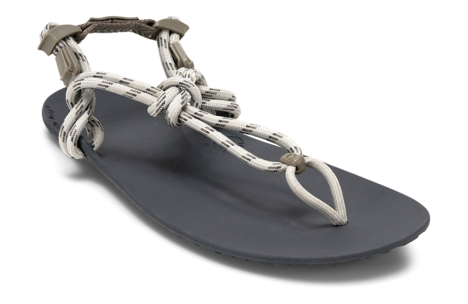Xero Shoes Canada, specifically men’s barefoot shoes Canada. These minimalist shoes have flexible soles, wide toe boxes, and zero drop. Angled view of Xero Men's Genesis in Stone. Lightweight, packable, travel-friendly sandal.