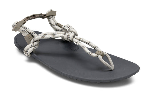 Xero Shoes Canada, specifically women’s barefoot shoes Canada. These minimalist shoes have flexible soles, wide toe boxes, and zero drop. Angled view of Xero Women's Genesis in Stone. Lightweight, packable, travel-friendly sandal.