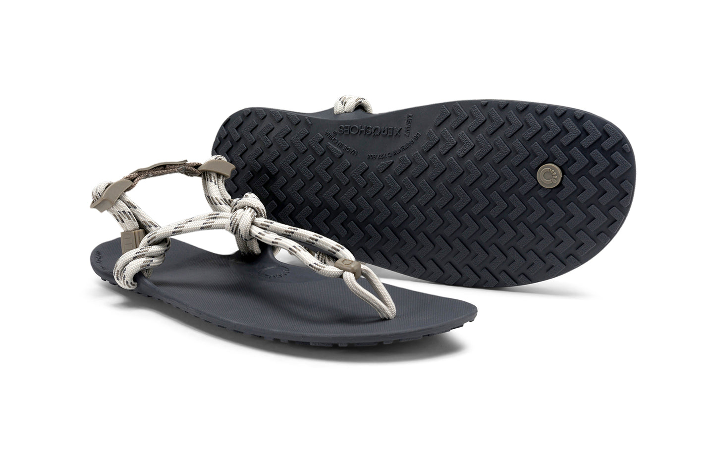 Xero Shoes Canada, specifically women’s barefoot shoes Canada. These minimalist shoes have flexible soles, wide toe boxes, and zero drop. Pair view of Xero Women's Genesis in Stone. Lightweight, packable, travel-friendly sandal.
