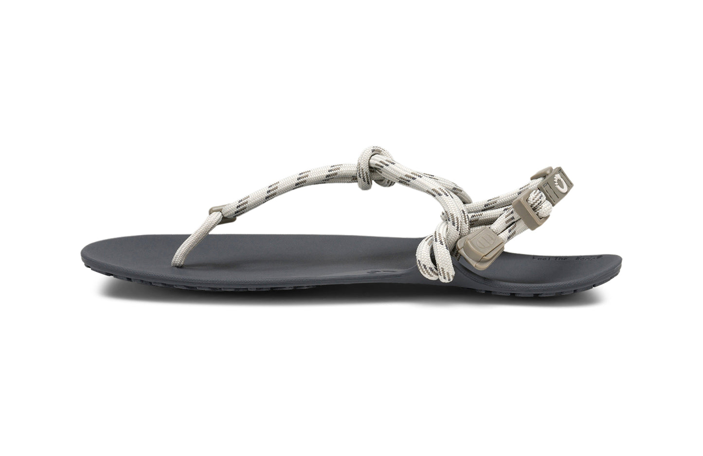 Xero Shoes Canada, specifically women’s barefoot shoes Canada. These minimalist shoes have flexible soles, wide toe boxes, and zero drop. Medial side view of Xero Women's Genesis in Stone. Lightweight, packable, travel-friendly sandal.