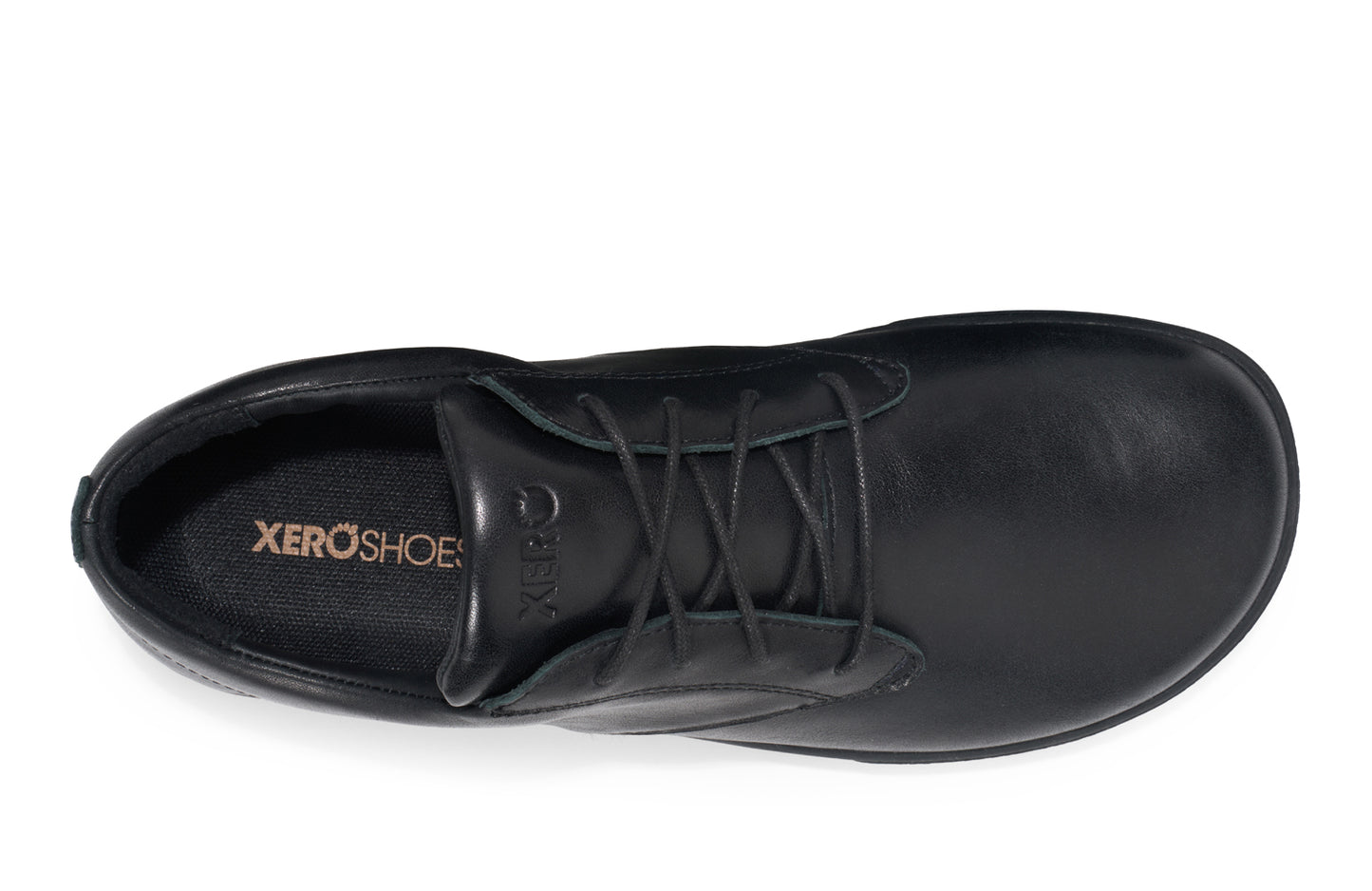 Xero Shoes Canada, specifically men’s barefoot shoes Canada. These minimalist shoes have flexible soles, wide toe boxes, and zero drop. Top view of Xero Men's Glenn Dress in Black. Dressy leather sneaker.