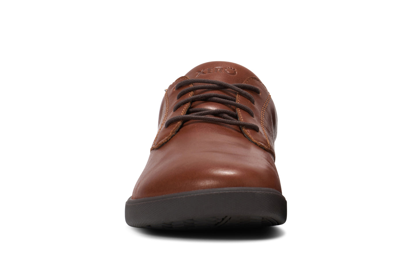 Xero Shoes Canada, specifically men’s barefoot shoes Canada. These minimalist shoes have flexible soles, wide toe boxes, and zero drop. Front view of Xero Men's Glenn Dress in Brown. Dressy leather sneaker.
