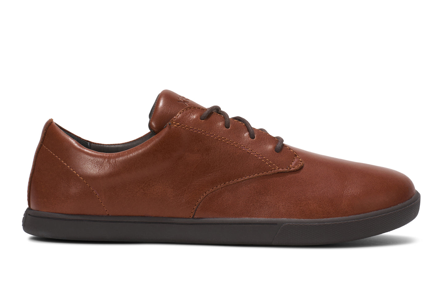 Xero Shoes Canada, specifically men’s barefoot shoes Canada. These minimalist shoes have flexible soles, wide toe boxes, and zero drop. Side view of Xero Men's Glenn Dress in Brown. Dressy leather sneaker.