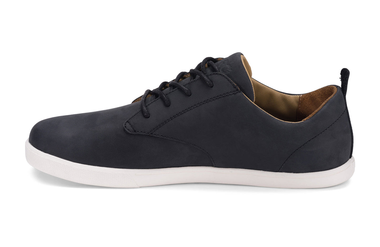 Xero Shoes Canada, specifically men’s barefoot shoes Canada. These minimalist shoes have flexible soles, wide toe boxes, and zero drop. Medial side view of Xero Men's Glenn in Black/White. Dress casual leather shoe.