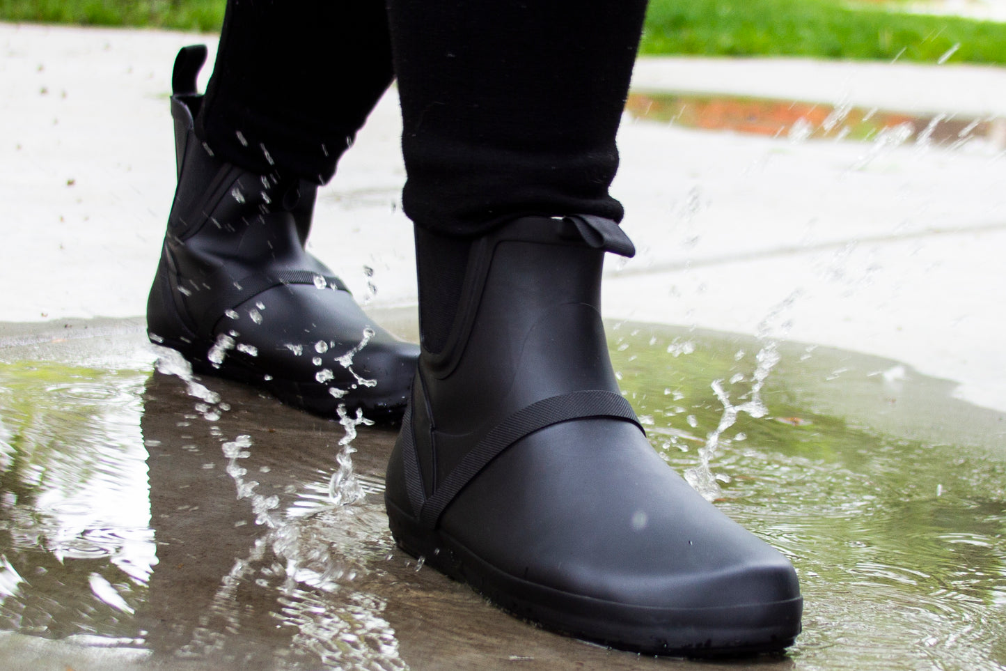 Xero Shoes Canada, specifically women’s barefoot shoes Canada. Woman wearing Gracies in rain on sidewalk