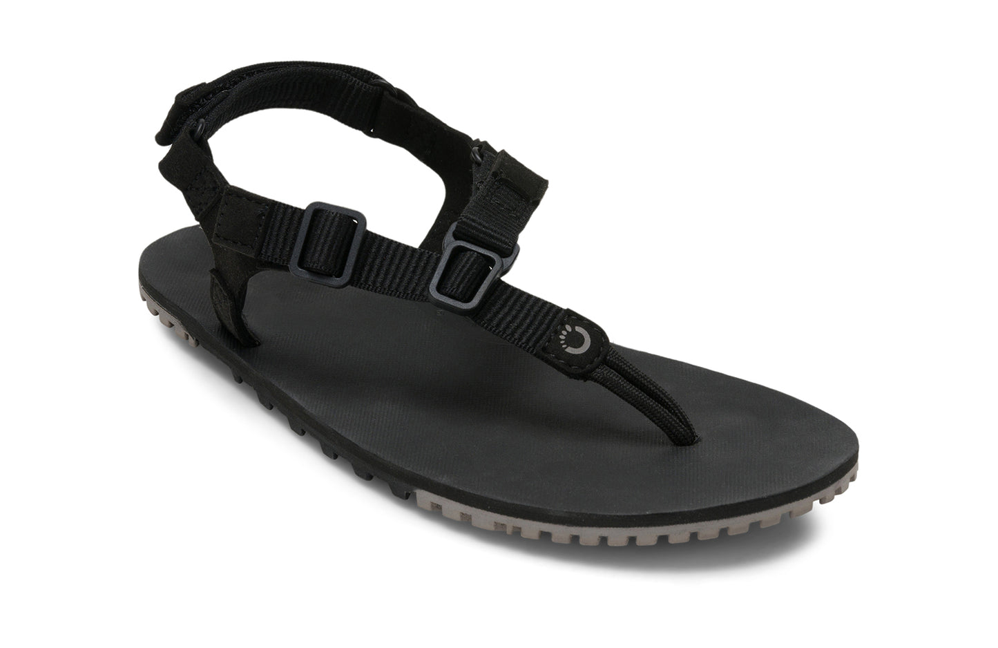 Xero Shoes Canada, specifically men’s barefoot shoes Canada. These minimalist shoes have flexible soles, wide toe boxes, and zero drop. Angled view of Men's H-Trail in Black. A huarache-style hiking sandal.