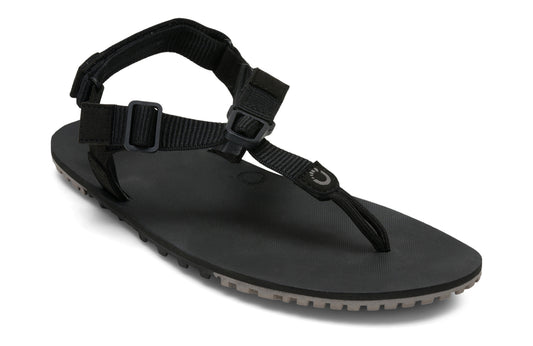 Xero Shoes Canada, specifically women’s barefoot shoes Canada. These minimalist shoes have flexible soles, wide toe boxes, and zero drop. Angled view of Women's H-Trail in Black. A huarache-style hiking sandal.