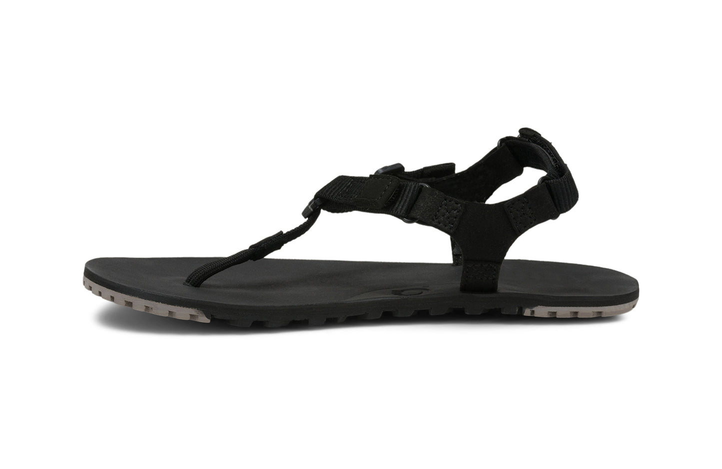 Xero Shoes Canada, specifically men’s barefoot shoes Canada. These minimalist shoes have flexible soles, wide toe boxes, and zero drop. Side view of Men's H-Trail in Black. A huarache-style hiking sandal.
