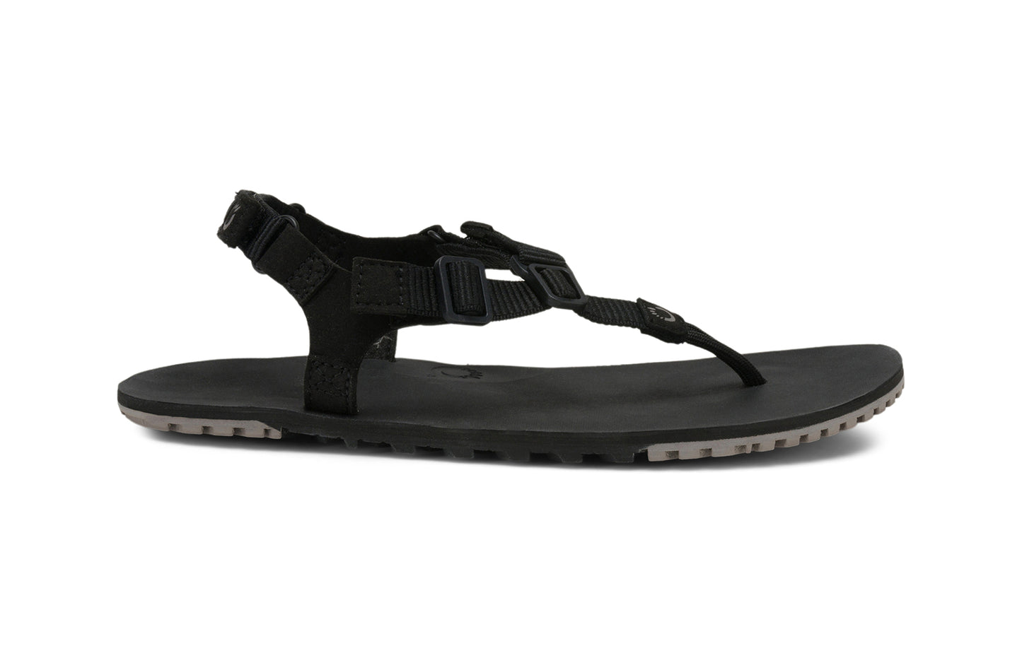 Xero Shoes Canada, specifically men’s barefoot shoes Canada. These minimalist shoes have flexible soles, wide toe boxes, and zero drop. Lateral side view of Men's H-Trail in Black. A huarache-style hiking sandal.