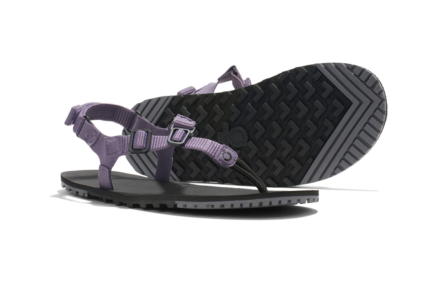 Xero Shoes Canada, specifically women’s barefoot shoes Canada. These minimalist shoes have flexible soles, wide toe boxes, and zero drop. Pair view of Women's H-Trail in Sage Purple. A huarache-style hiking sandal.