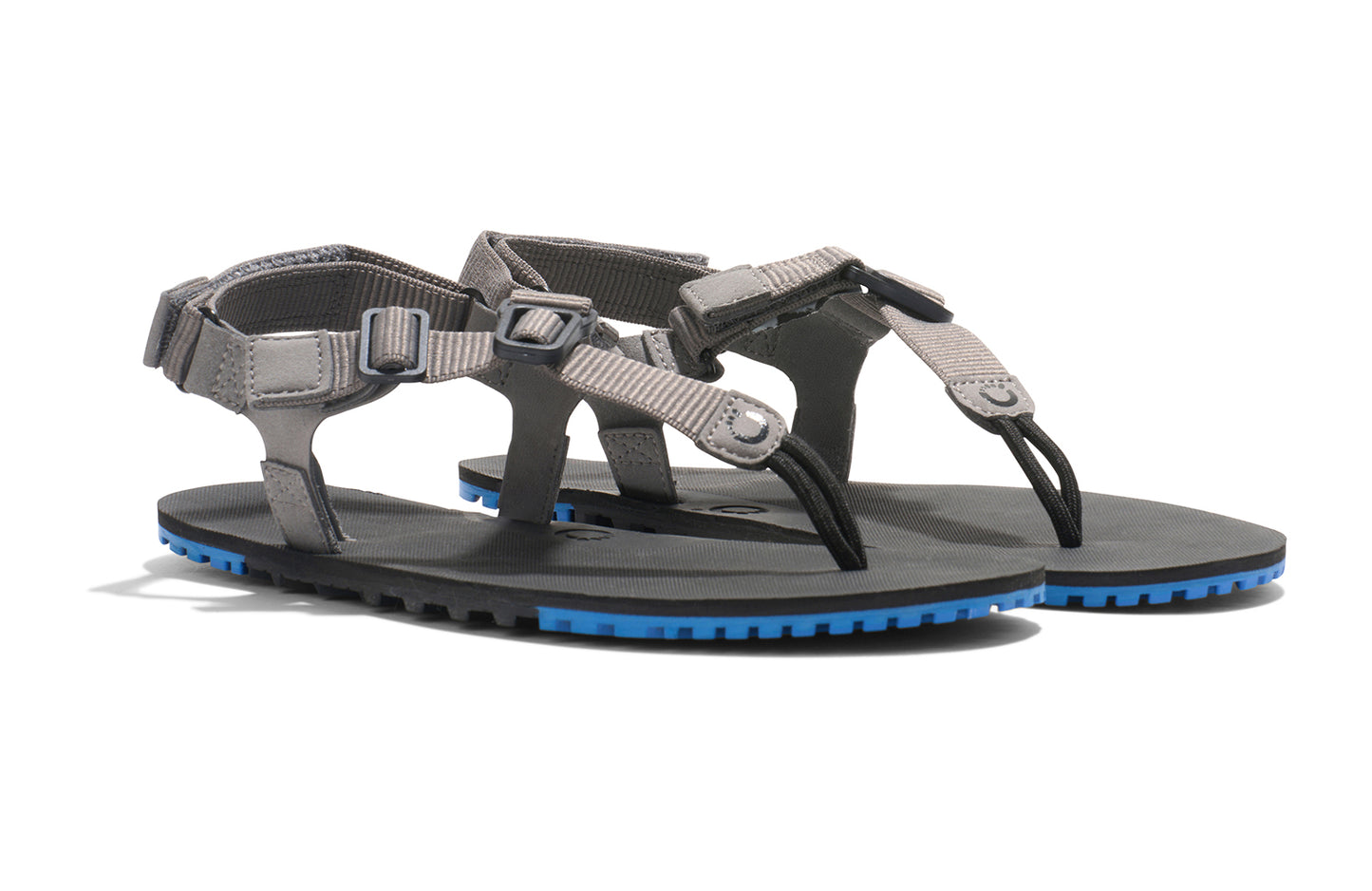 Xero Shoes Canada, specifically men’s barefoot shoes Canada. These minimalist shoes have flexible soles, wide toe boxes, and zero drop. Angled view of Men's H-Trail in Steel Gray/Blue Iolite. A huarache-style hiking sandal.