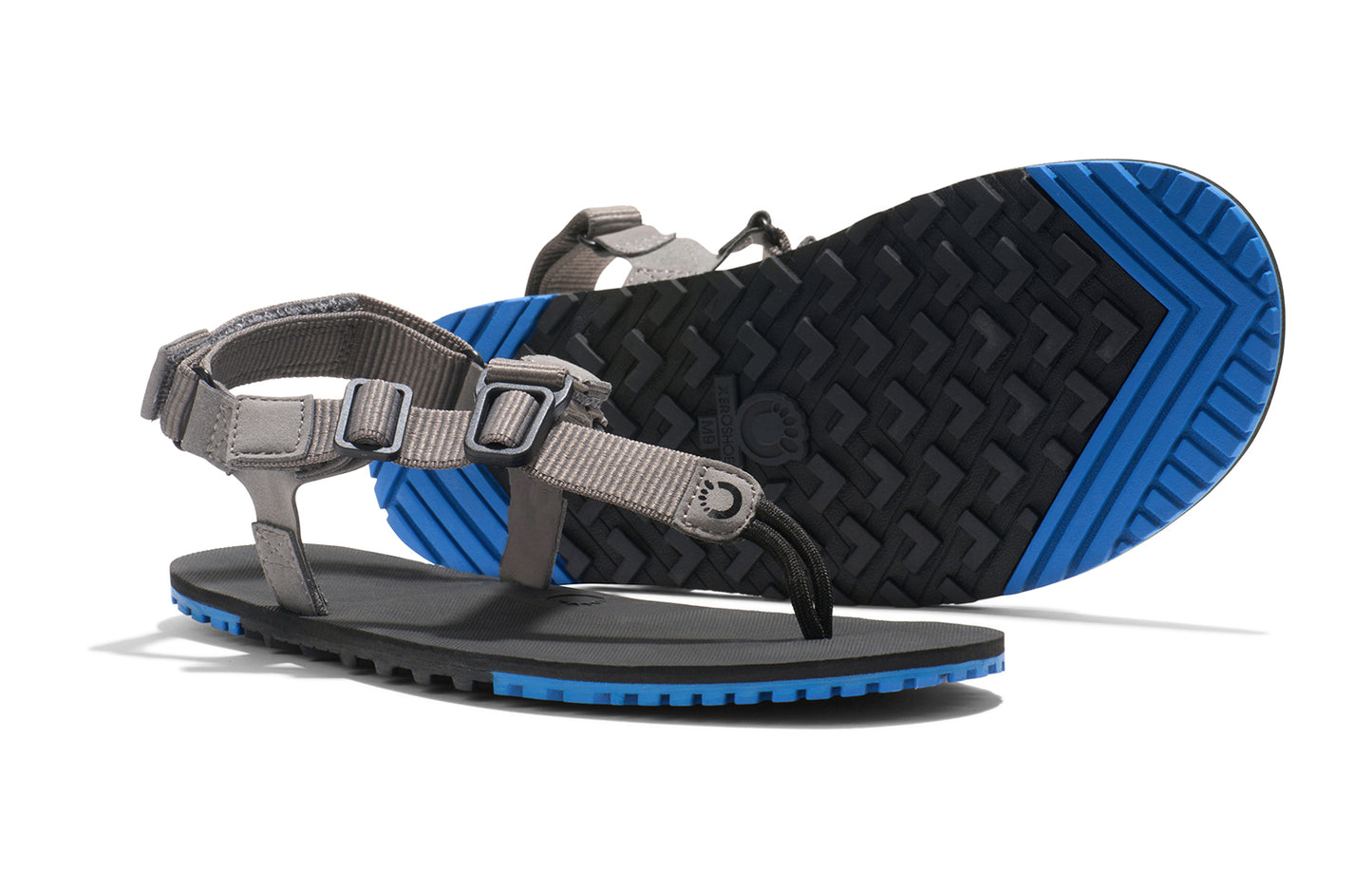 Xero Shoes Canada, specifically men’s barefoot shoes Canada. These minimalist shoes have flexible soles, wide toe boxes, and zero drop. Pair view of Men's H-Trail in Steel Gray/Blue Iolite. A huarache-style hiking sandal.