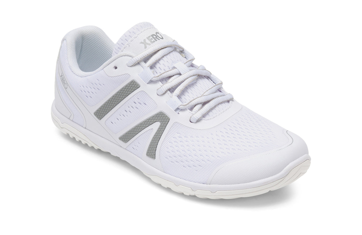 Xero Shoes Canada, specifically barefoot running shoes Canada. These minimalist shoes have flexible soles, wide toe boxes, and zero drop. Angled view of Xero Women's HFS II in White. Lightweight road runner.