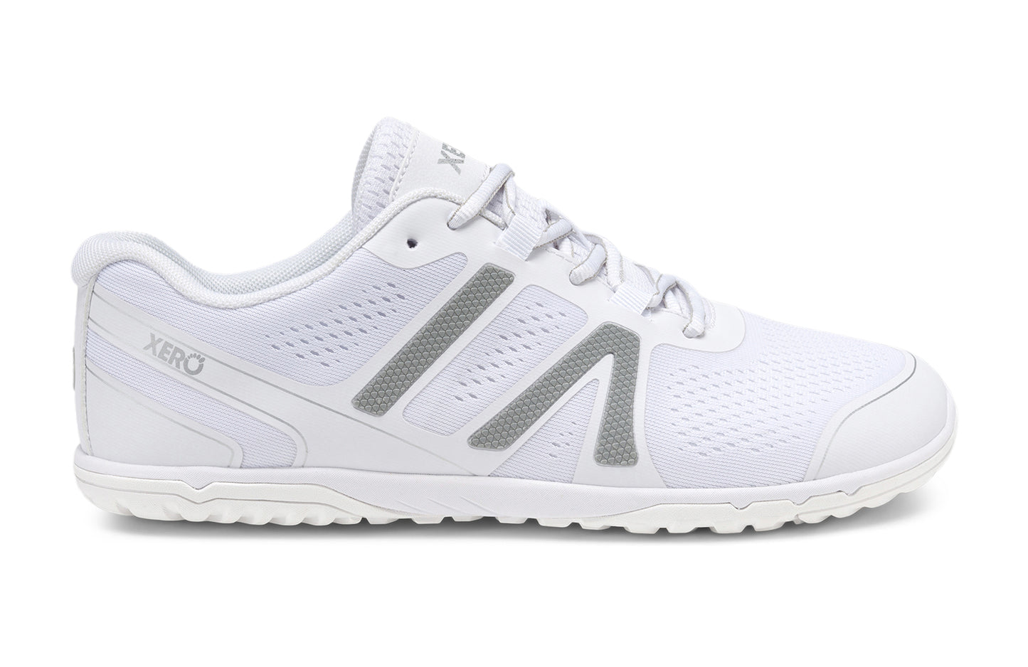 Xero Shoes Canada, specifically barefoot running shoes Canada. These minimalist shoes have flexible soles, wide toe boxes, and zero drop. Lateral side view of Xero Men's HFS II in White. Lightweight road runner.