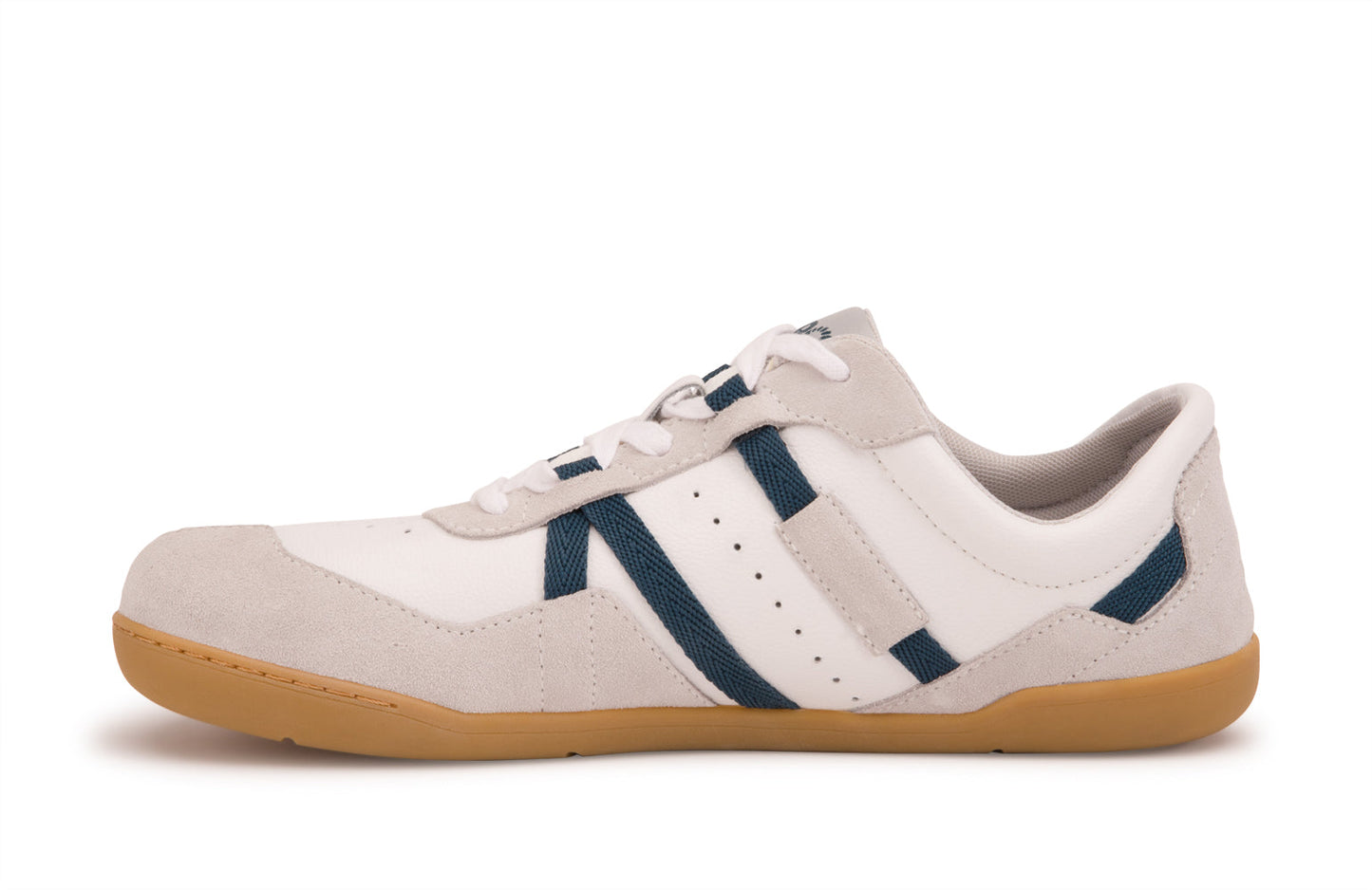 Xero Shoes Canada, specifically women’s barefoot shoes Canada. These minimalist shoes have flexible soles, wide toe boxes, and zero drop. Medial side view of Xero Women's Kelso in White. Leather and suede court-style shoe.