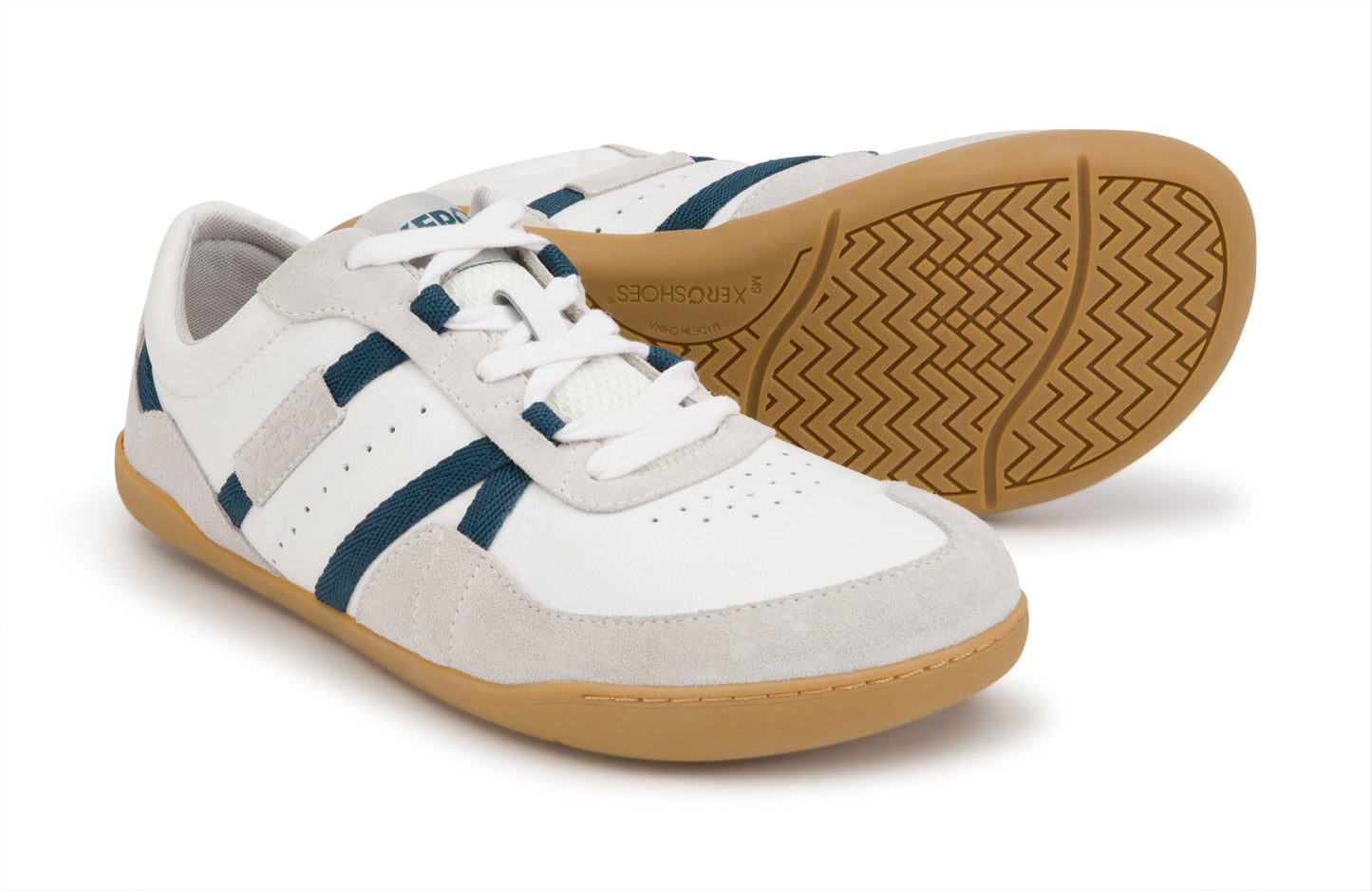 Xero Shoes Canada, specifically women’s barefoot shoes Canada. These minimalist shoes have flexible soles, wide toe boxes, and zero drop. Pair view of Xero Women's Kelso in White. Leather and suede court-style shoe.