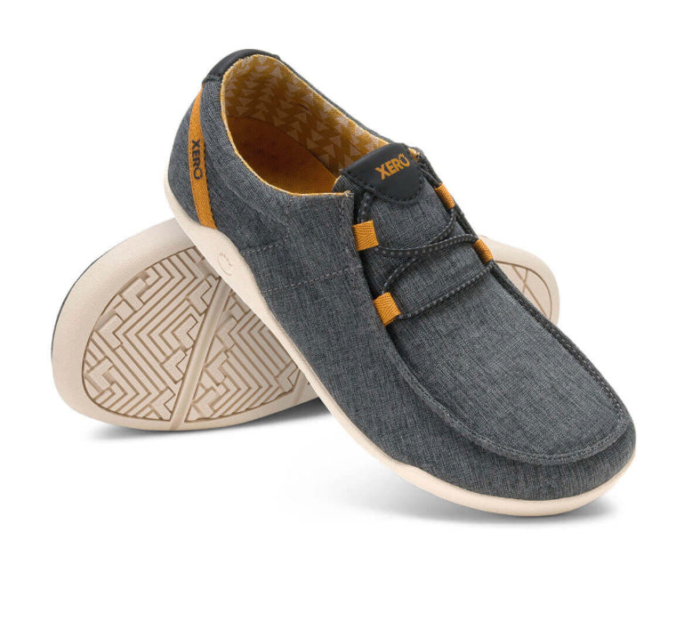 Xero Shoes Canada, specifically women’s barefoot shoes Canada. These minimalist shoes have flexible soles, wide toe boxes, and zero drop. Angled pair view of Xero Women's Kona in Asphalt. Moccasin inspired casual shoe.