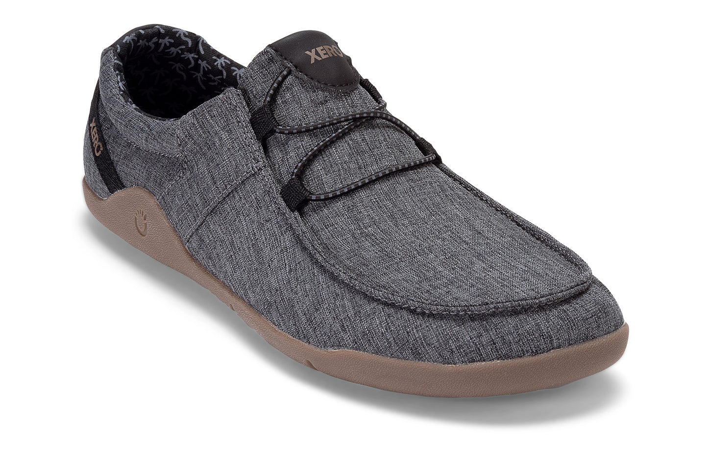 Xero Shoes Canada, specifically men’s barefoot shoes Canada. These minimalist shoes have flexible soles, wide toe boxes, and zero drop. Angled view of Xero Men's Kona in Asphalt. Moccasin inspired casual shoe.