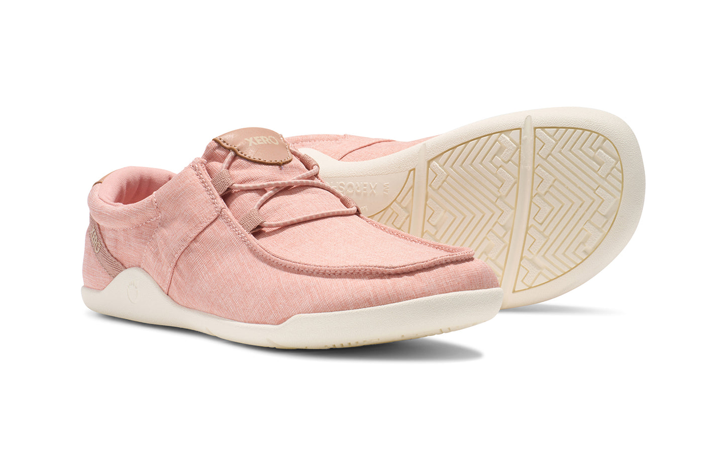 Xero Shoes Canada, specifically women’s barefoot shoes Canada. These minimalist shoes have flexible soles, wide toe boxes, and zero drop. Pair view of Xero Women's Kona in Pink Sand. Moccasin inspired casual shoe.