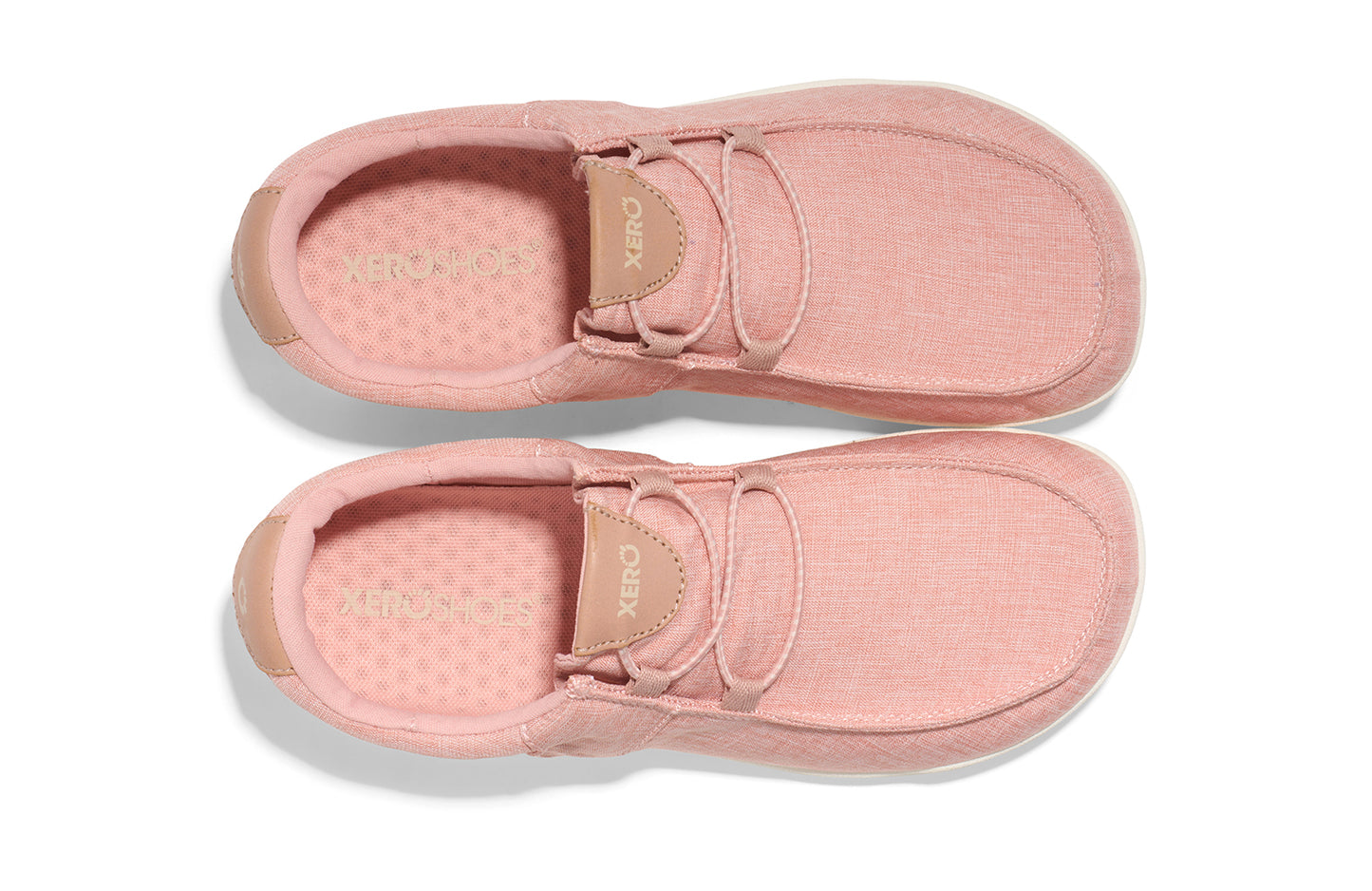 Xero Shoes Canada, specifically women’s barefoot shoes Canada. These minimalist shoes have flexible soles, wide toe boxes, and zero drop. Top view of Xero Women's Kona in Pink Sand. Moccasin inspired casual shoe.
