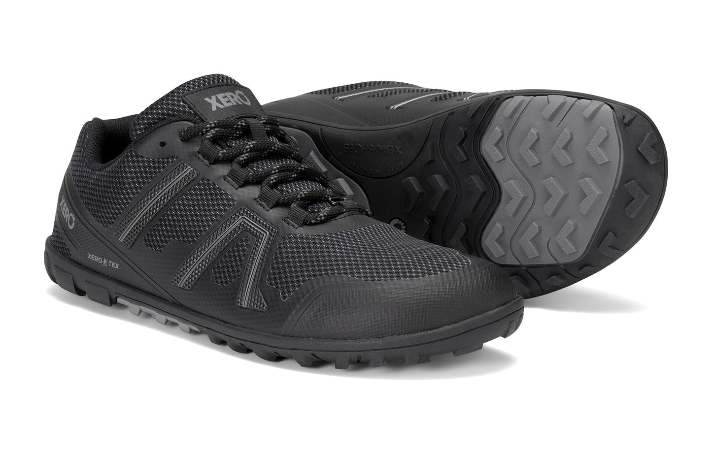 Xero Shoes Canada, specifically barefoot hiking shoes Canada. These minimalist shoes have flexible soles, wide toe boxes, and zero drop. Side and sole pair view of Xero Women's Mesa Trail II in Black. Durable, waterproof hiking shoe.