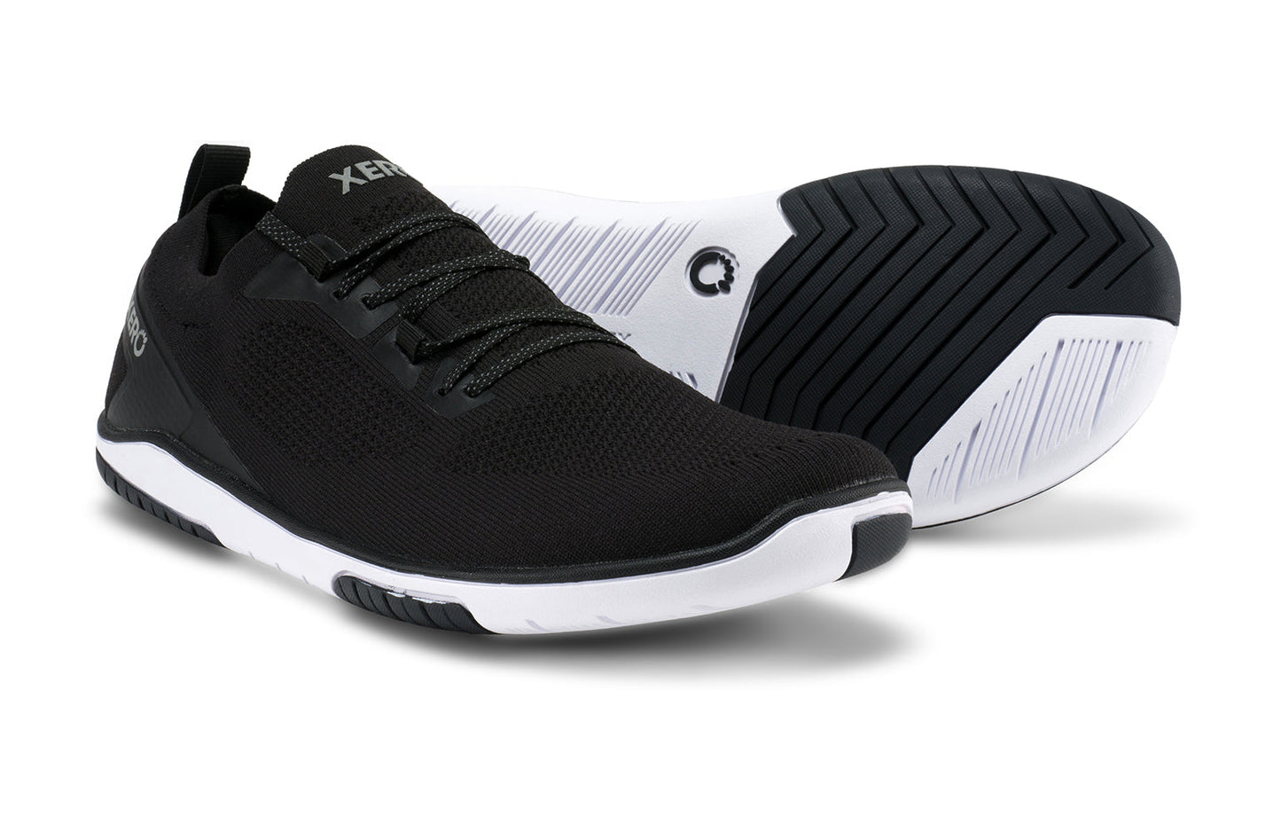 Xero Shoes Canada, specifically barefoot running shoes Canada. These minimalist shoes have flexible soles, wide toe boxes, and zero drop. Pair view of Xero Men's Nexus Knit in Black. An athletic, comfortable shoe.