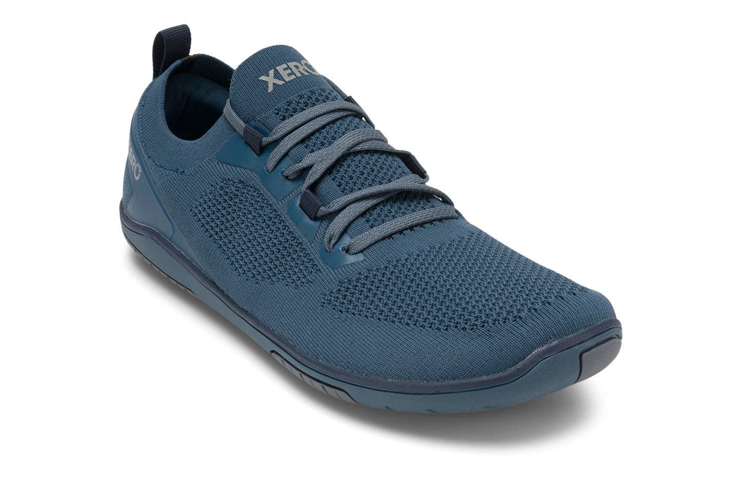 Xero Shoes Canada, specifically barefoot running shoes Canada. These minimalist shoes have flexible soles, wide toe boxes, and zero drop. Angled view of Xero Men's Nexus Knit in Orion Blue. An athletic, comfortable shoe.