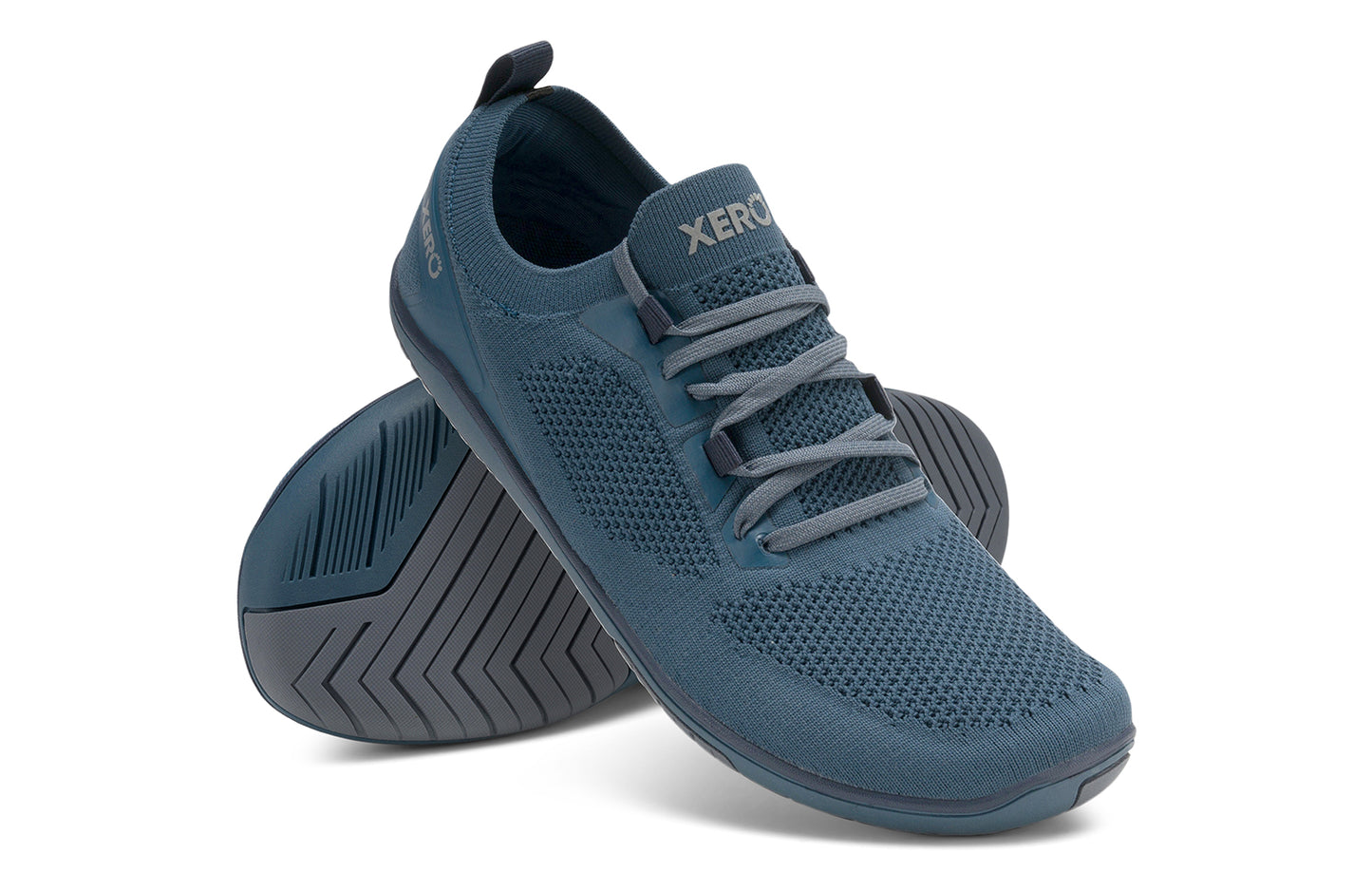 Xero Shoes Canada, specifically barefoot running shoes Canada. These minimalist shoes have flexible soles, wide toe boxes, and zero drop. Angled pair view of Xero Men's Nexus Knit in Orion Blue. An athletic, comfortable shoe.