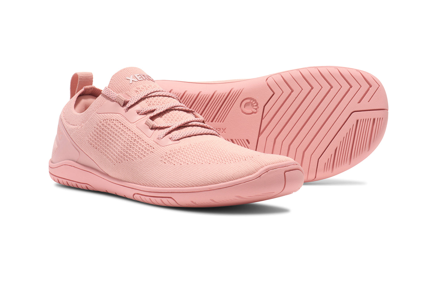 Xero Shoes Canada, specifically barefoot running shoes Canada. These minimalist shoes have flexible soles, wide toe boxes, and zero drop. Pair view of Xero Women's Nexus Knit in Pink Sand. An athletic, comfortable shoe.