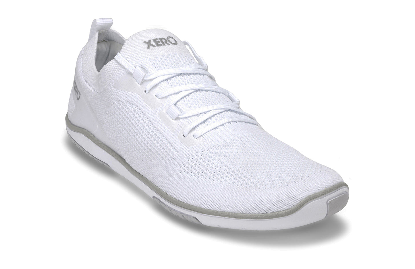Xero Shoes Canada, specifically barefoot running shoes Canada. These minimalist shoes have flexible soles, wide toe boxes, and zero drop. Angled view of Xero Men's Nexus Knit in White. An athletic, comfortable shoe.