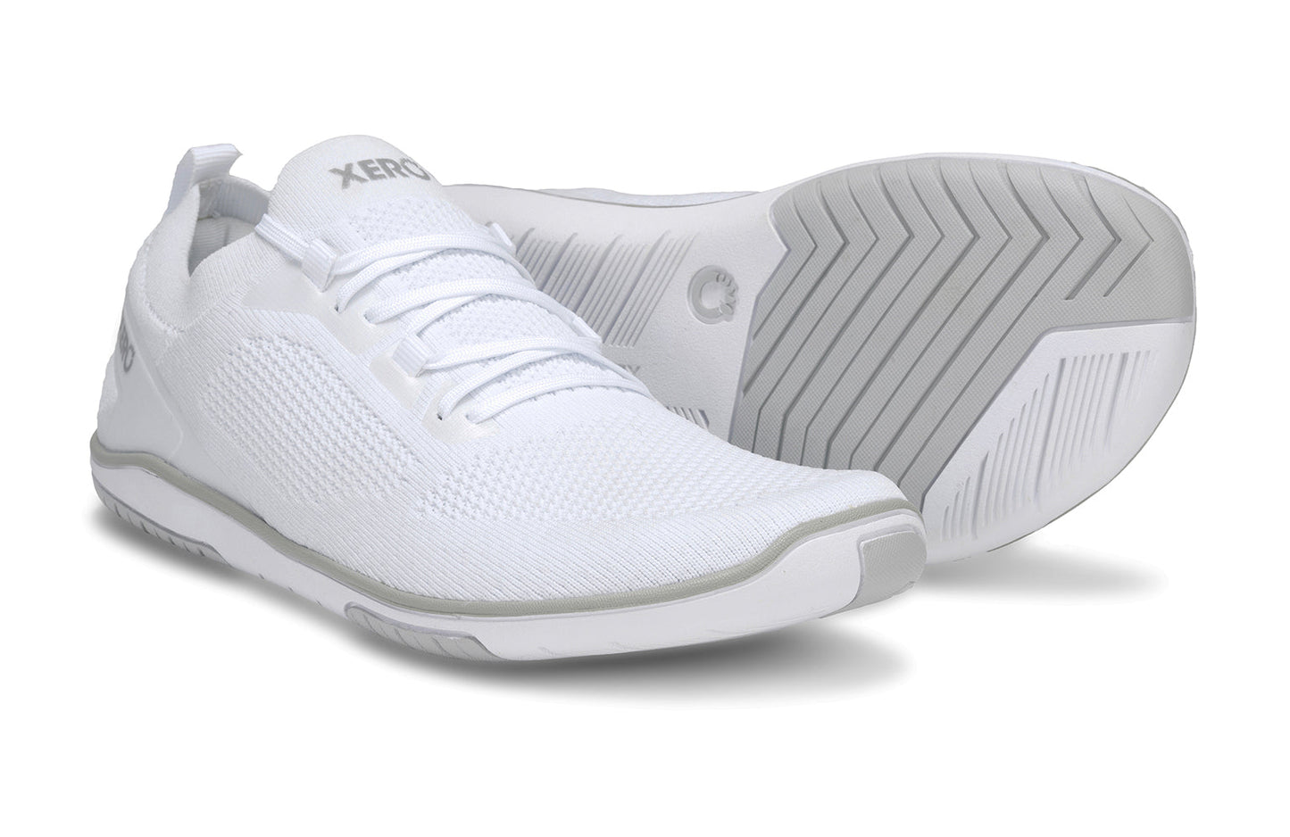 Xero Shoes Canada, specifically barefoot running shoes Canada. These minimalist shoes have flexible soles, wide toe boxes, and zero drop. Pair view of Xero Men's Nexus Knit in White. An athletic, comfortable shoe.