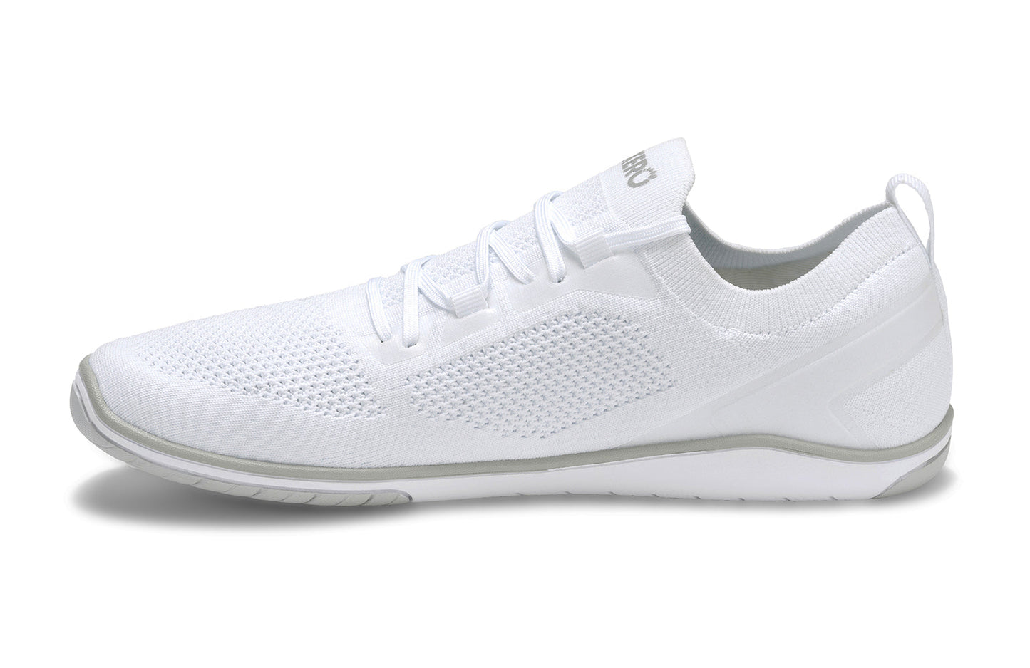 Xero Shoes Canada, specifically barefoot running shoes Canada. These minimalist shoes have flexible soles, wide toe boxes, and zero drop. Side view of Xero Men's Nexus Knit in White. An athletic, comfortable shoe.